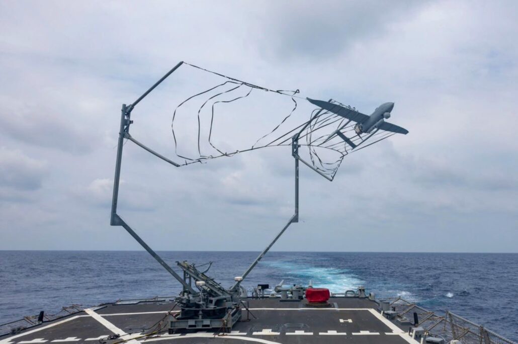 A drone launching from a military grade turntable system