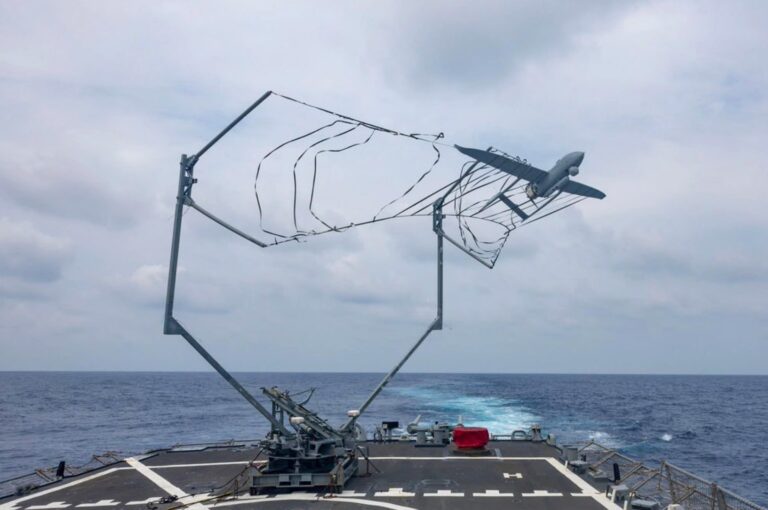 A drone launching from a military grade turntable system