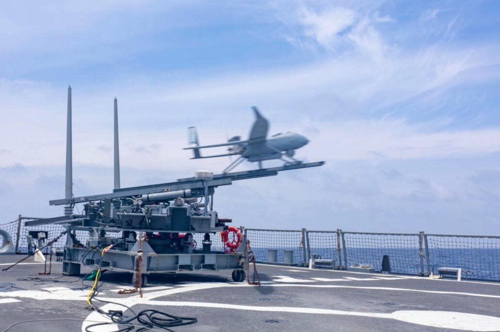 A drone launching from a military grade turntable system